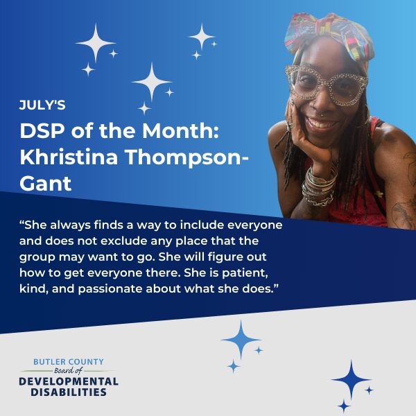 A blue graphic with stars and a photo of a women smiling with text that says, "July's DSP of the Month: Khristina Thompson-Gant. 'She always finds a way to include everyone and does not exclude any place that the group may want to go. She will figure out how to get everyone there. She is patient, kind, and passionate about what she does.”