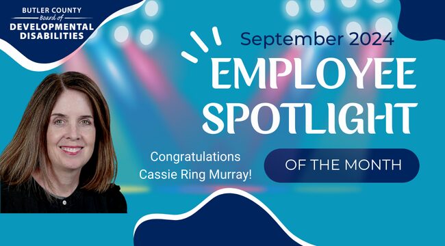 A graphic with a spotlight and a headshot of female smiling with text that reads, "Congratulations Cassie Ring Murray, September 2024 Employee Spotlight of the Month."